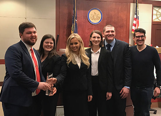 Trial Team members and coaches after winning the 2018 Regional AAJ Student Trial Advocacy Competition